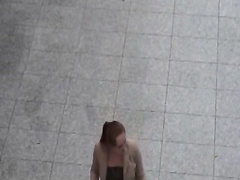 Redhead chick has sex on the stairs of a shopping mall