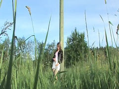 Busty teen dildoing hole in the grass