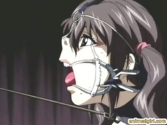 Chained hentai with a muzzle gets humiliated