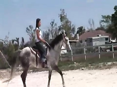 Chick from Thailand riding a horse